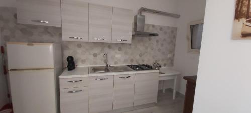 Kuchyň nebo kuchyňský kout v ubytování Casa del Faro