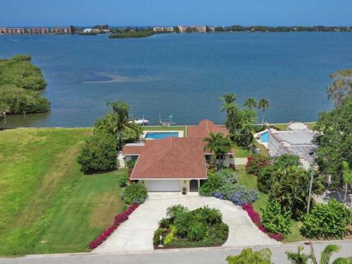 an aerial view of a house with a view of the water at 8730 Dunmore Dr in Vamo