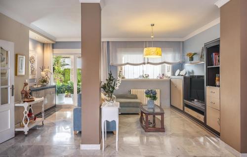 a living room with a couch and a tv at Beautiful Home In Illora in Illora