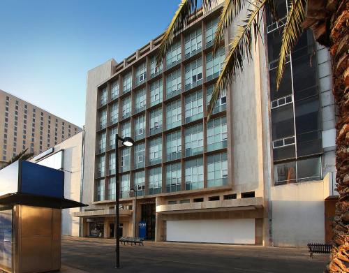 a large building with a lot of windows at One Ciudad de Mexico Alameda in Mexico City