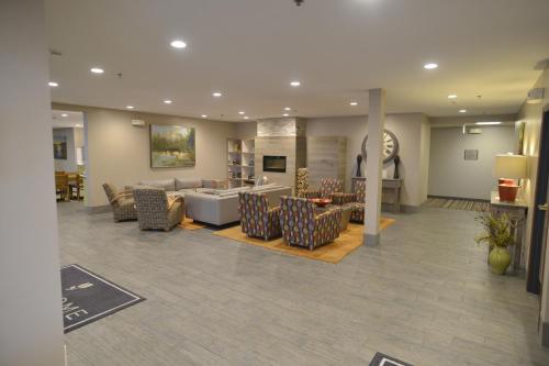 a lobby with a couch and chairs and a table at Country Inn & Suites by Radisson, Duluth North, MN in Duluth