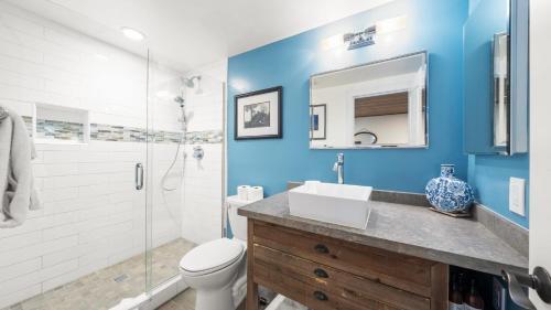 a bathroom with a sink and a toilet and a shower at Near Ski Beach Hiking Trails Clubhouse Pool Hot Tub Access Juanita Blue by AvantStay in Incline Village