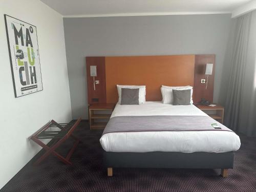 Ένα ή περισσότερα κρεβάτια σε δωμάτιο στο ibis Styles Bielsko Biala
