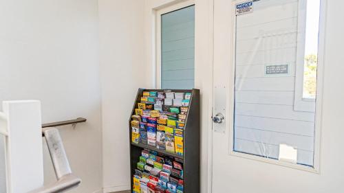 a door with a display of cards next to it at 4 Cayucos Bungalows Steps to Beach Sleeps 16 Pet Friendly in Cayucos