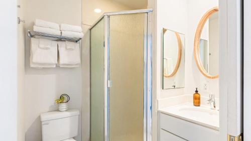 a bathroom with a shower and a toilet and a sink at 4 Cayucos Bungalows Steps to Beach Sleeps 16 Pet Friendly in Cayucos