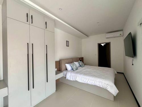 Ένα ή περισσότερα κρεβάτια σε δωμάτιο στο Wonderland Nest 4 Bedroom Luxury Pool Villa