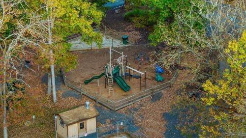 an overhead view of a playground in a park at Stylish Mountain Retreat w Hot Tub Firepit Penn Estate Getaway by AvantStay in East Stroudsburg