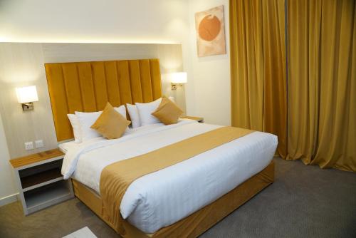 Ένα ή περισσότερα κρεβάτια σε δωμάτιο στο view Rose Hotel Apartment
