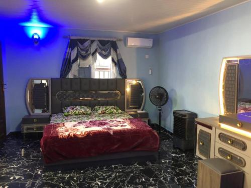 a bedroom with a bed and a dresser and a window at Cozy Flat 5 Minutes To Beach in Freetown