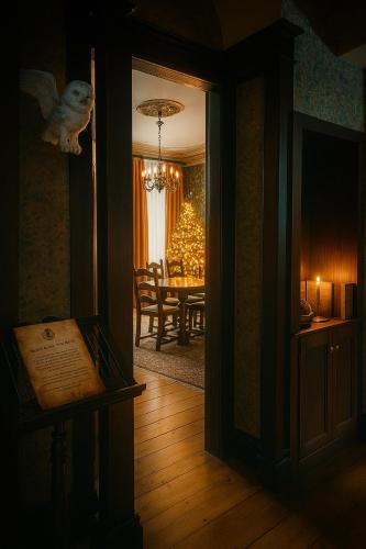 a hallway with a dining room with a dining table at Wizards Lodge in Malmedy