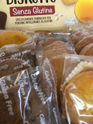 a box of donuts in plastic bags on a table at B&B Agrimare SAN SALVO MARINA in Marina di Montenero