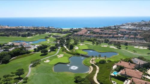 an overhead view of a golf course with two lakes at Backyard Oasis w Fire Table Walk to Salt Creek Beach Dana Point Dreams in Dana Point