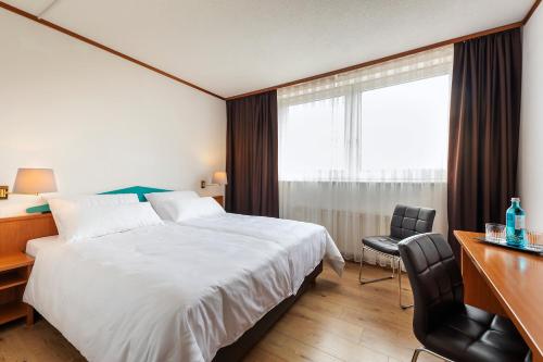 ACHAT Hotel Frankfurt Maintalにあるベッド