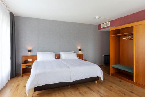 ACHAT Hotel Frankfurt Maintalにあるベッド