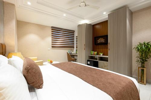 Postel nebo postele na pokoji v ubytování Hotel Luxury Plaza Delhi Airport