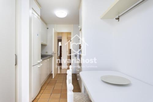 a white bathroom with a white tub and a sink at The Mills Santa Cruz, by Nivariahost in Santa Cruz de Tenerife