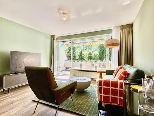 Телевизор и/или развлекательный центр в Snug Stays 8 - ruhige Toplage Seeblick Design-Wohnung I 3-Zimmer I zentral