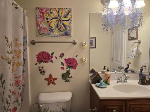 a bathroom with a sink and a toilet and a mirror at 2066 Hawkins Mill Road in Lynchburg