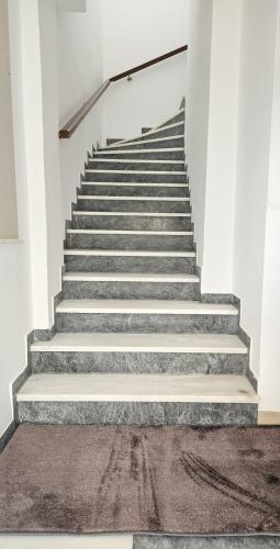 a staircase in a building with concrete steps at Sunshore Center apartment #4 in Chalkida
