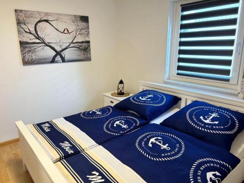 Postel nebo postele na pokoji v ubytování FeWo Nordlicht