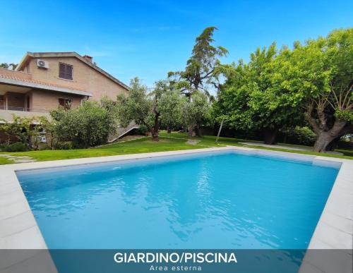 a swimming pool in the backyard of a house at Villa Gelsi a Pesaro in Pozzo Alto