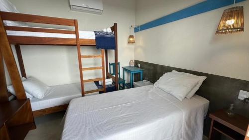 a bedroom with two bunk beds and a ladder at Sunshine Kite Inn in Prea
