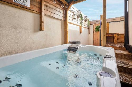 a jacuzzi tub with a toilet in it at Host & Stay - Salt Rock Retreat in Skelton