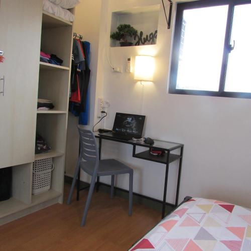 a bedroom with a desk and a chair and a bed at Casa Devino - Discover the Perfect Condo Getaway in Luxury, Kareoke, Netflix, Free Parking in Tagaytay
