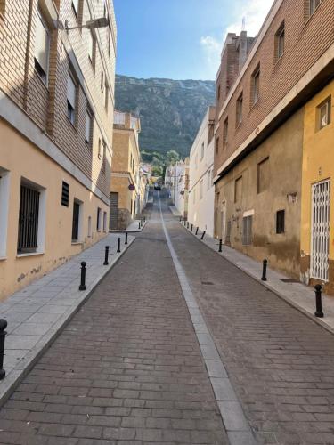 an empty street in an alley with buildings at Cullera Mountain View in Cullera