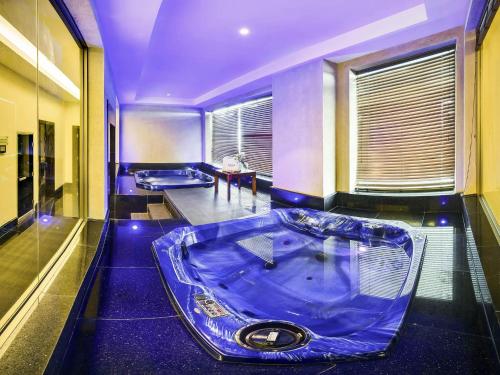a bathroom with two jacuzzi tubs in a room at Sofitel Al Khobar The Corniche in Al Khobar