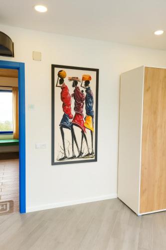 a painting of women playing basketball on a wall at Hovk Farms in Dilijan