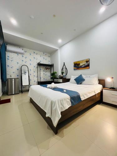 a bedroom with a large bed in a room at candyinn in Hue