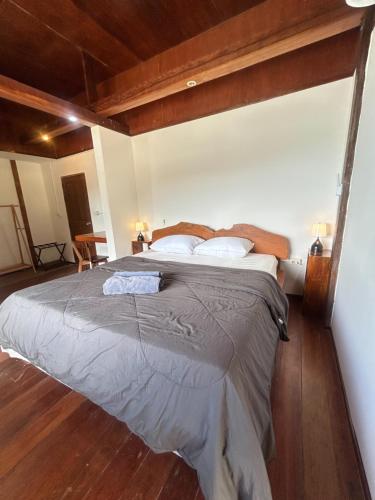 a bedroom with a large bed in a room at Lam Sai village hotel Koh Yao Noi in Ko Yao Noi