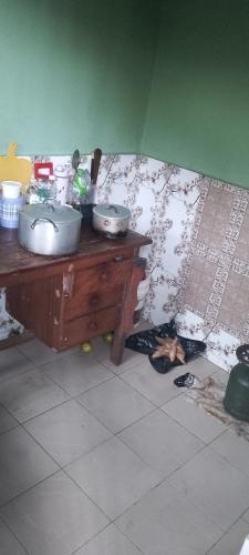 a kitchen with a counter with two sinks and a wall at Harmony 2 bedroom apartment in Calabar
