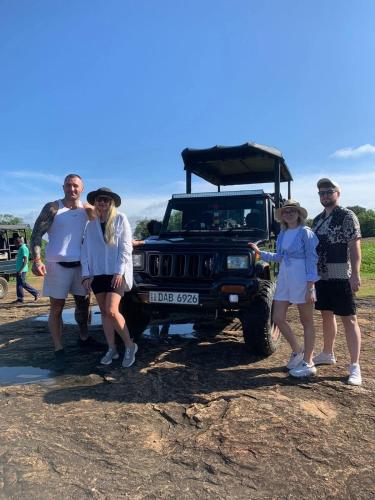 a group of people standing in front of a jeep at Maika safari lodge in Udawalawe