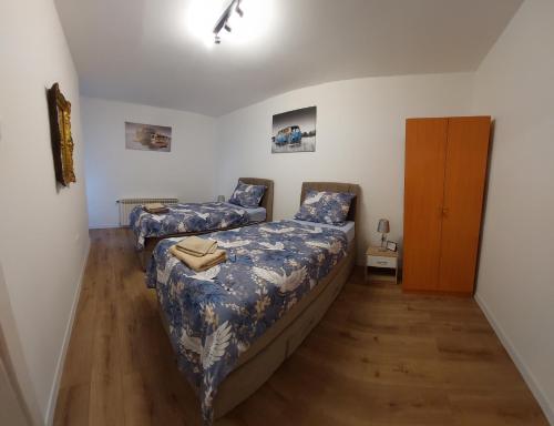 Postel nebo postele na pokoji v ubytování Apartman NEDA