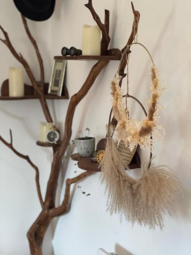 a branch shelf with a basket on a wall at La Grange in Savenay