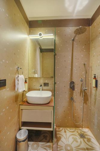 a bathroom with a sink and a shower at Hotel Red Martin 2 min walk from Golden Temple in Amritsar