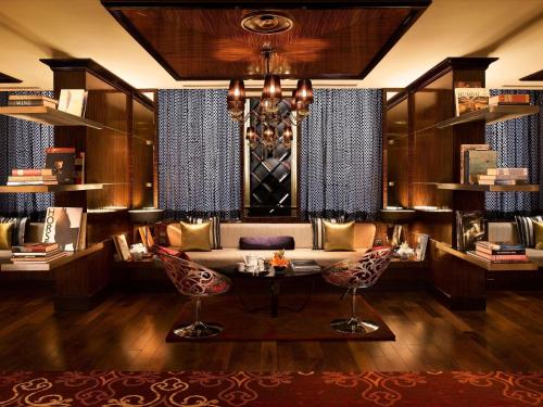 a living room with a couch and a table at Sofitel Mumbai BKC in Mumbai