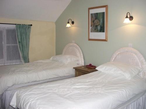 Ένα ή περισσότερα κρεβάτια σε δωμάτιο στο The George Hotel