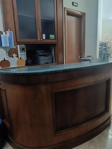 a kitchen with a counter top with a microwave at Hotel Alexia in Catanzaro