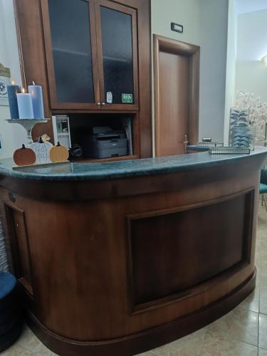 a bar in a hotel room with a counter at Hotel Alexia in Catanzaro