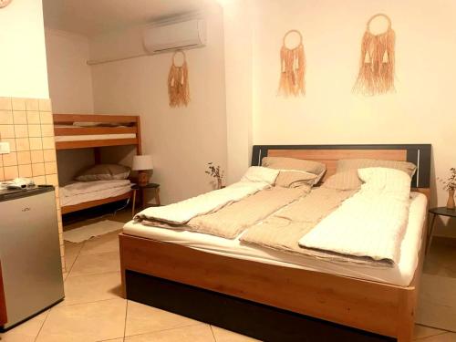a bedroom with a bed in a room at Betyár-Lak in Kaba