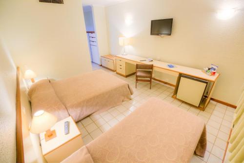Un ou plusieurs lits dans un hébergement de l'établissement Hotel Dan Inn Uberaba & Convenções By Nacional Inn
