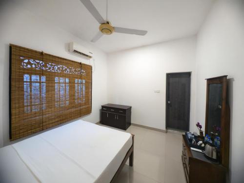 Ein Bett oder Betten in einem Zimmer der Unterkunft Moi Dambulla by DBI