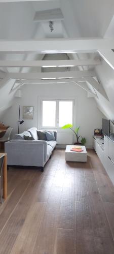 a living room with a couch and a table at New V Luxury Apartment in Amsterdam