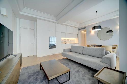 a living room with a couch and a table at Mirabilis Apartments - AAA23 in Lisbon