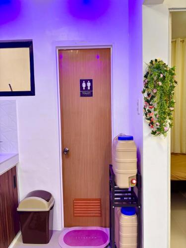 a door with a sign on it next to a room at Athena & Storm the Bay Nook in Victoria