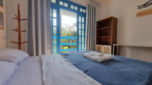 Katil atau katil-katil dalam bilik di Casa com 3 suítes perto do mar Ubatuba - SFS