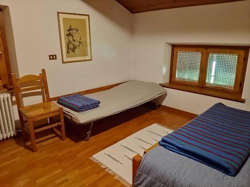 Ένα ή περισσότερα κρεβάτια σε δωμάτιο στο Casa Martinelli - Trameri